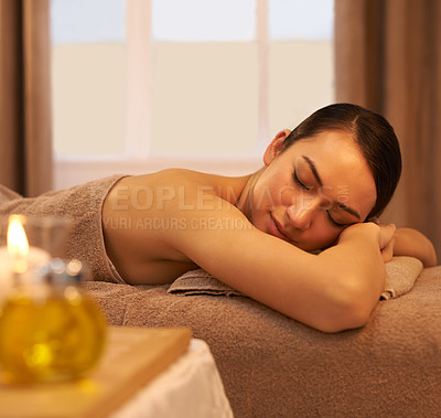 Buy stock photo Peace, sleep and woman on massage table at spa for self care, stress relief and natural wellness. Female person, zen and calm at luxury hotel for body health, hospitality and spiritual healing