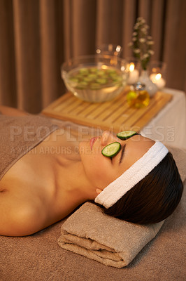 Buy stock photo Skincare, relax and woman with cucumber on face for massage in spa for peace, calm or wellness. Facial, salon and person with vegetable on eyes in therapy, natural beauty or healthy organic treatment