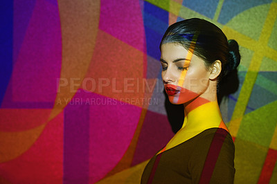 Buy stock photo Surreal, abstract and face of woman by color, art and pattern of shapes serious for creative career. Light, female person and lady by wall with skin for cosmetics, beauty and makeup or treatment