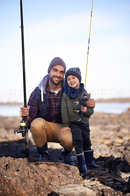 Buy stock photo Portrait, dad and son with nature, smile and happiness for bonding on break. Child, water and ocean with rocks, adventure and vacation on fishing trip with childhood memories and parent fun at sea