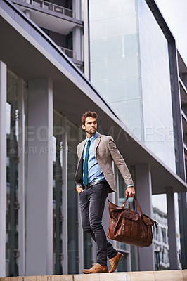 Buy stock photo Professional, walking and businessman travel in the city in suit working at the office with hands. Young, man and corporate in front of urban buildings as a worker commutes to a startup company.