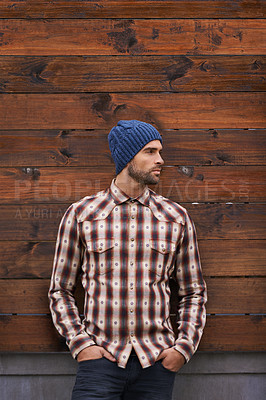 Buy stock photo Fashion, man and thinking on wooden wall outdoor for trendy, cool and style for urban with idea. Male person, choice and planning for weekend or holiday with winter outfit and stylish in Germany