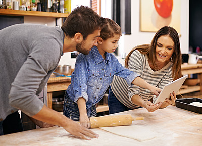 Buy stock photo Family, cooking and learning in kitchen with tablet for recipe, guide and parents reading with child in home. Baking, mom and dad with girl helping to meal prep and talking about pizza and dinner