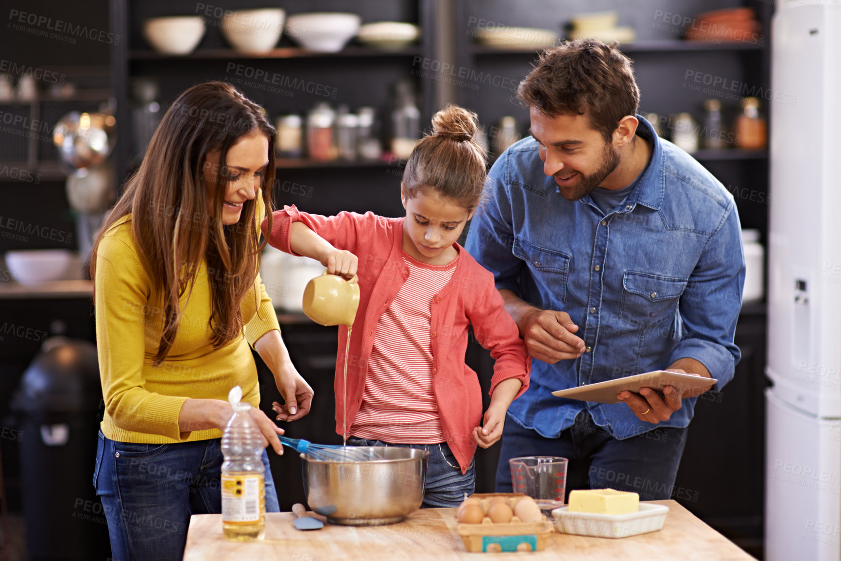 Buy stock photo Family, kitchen and tablet for baking with care, recipe online with ingredients for cake or dessert with support and handmade. Mom, dad and child cooking together with love for bonding or teaching