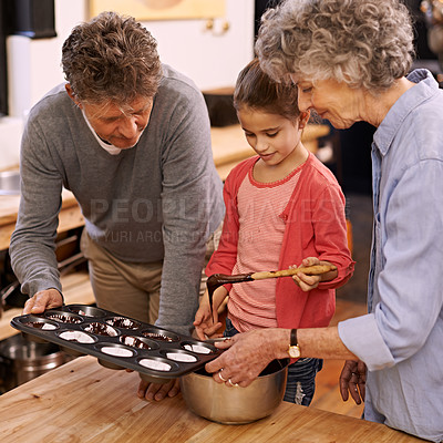 Buy stock photo Child, grandparents and baking with cupcakes, kitchen and bonding together. Mature woman, smile and girl with happiness, love and learning at home with grandmother for childhood memories and family