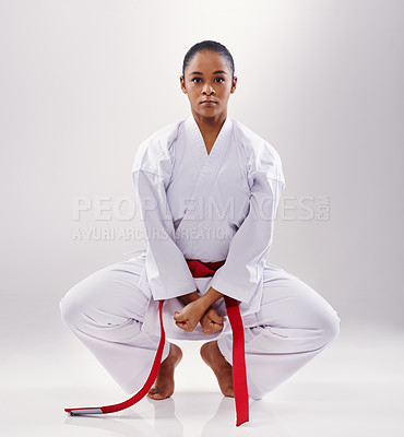 Buy stock photo Karate, exercise and portrait of woman in studio, white background and stretching in mockup space. Mma, student or person in martial arts with serious attitude of warrior for workout and training