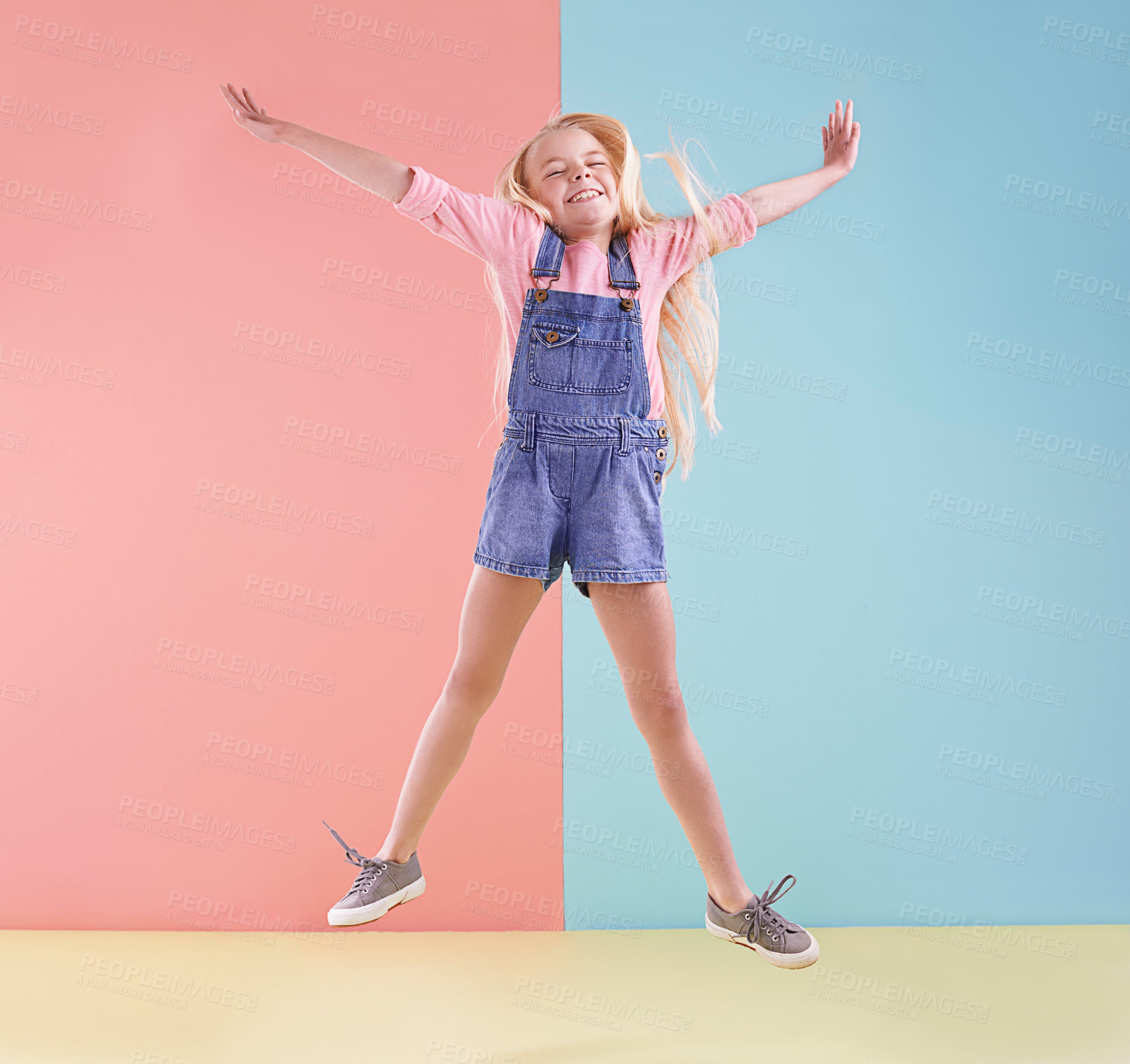 Buy stock photo Girl, jump and kid with celebration, excited and happiness on a colorful studio background. Model, mockup space and child with joy or excited with expression and achievement with wow, smile or energy