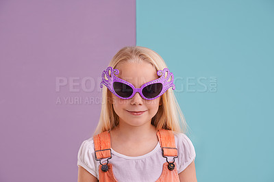 Buy stock photo Girl, child and sunglasses with fashion for style, funky clothes and colour block background. Confidence, young kid and groovy face accessory in studio with smile, happiness and trendy outfit