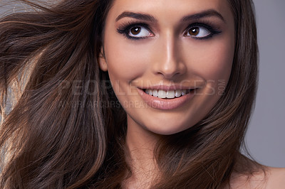 Buy stock photo Thinking, shine and glow with woman, hair care and aesthetic on grey studio background. Person, wellness and treatment with girl or model with texture and volume with healthy scalp, growth or shampoo