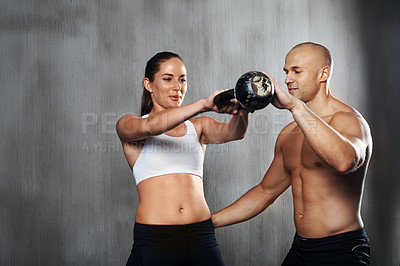 Buy stock photo Student, personal trainer and workout with kettlebell for fitness, support and exercise class together. Man, woman and training with equipment for bodybuilding, coaching and teamwork in weightlifting