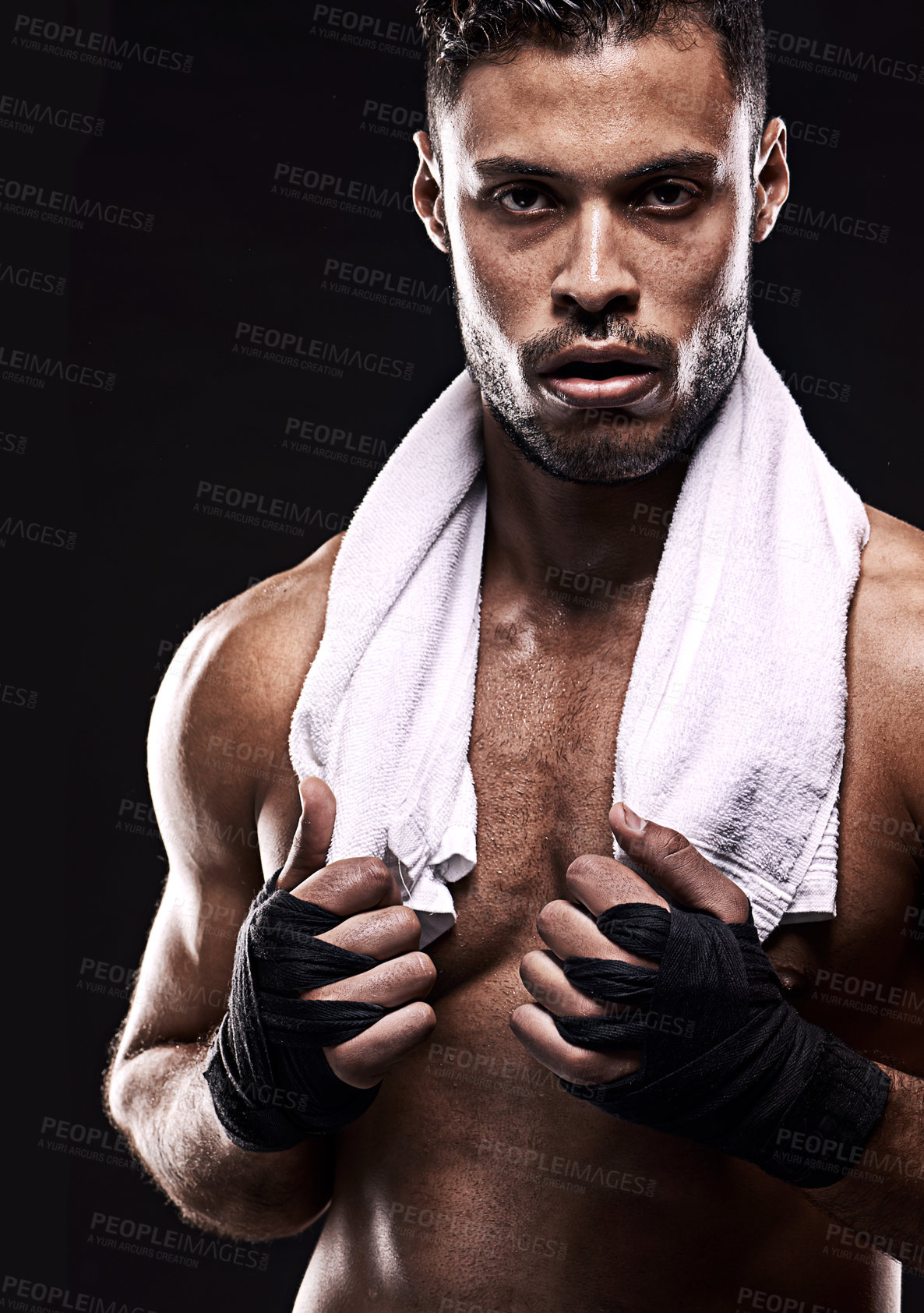 Buy stock photo Studio shot of a young boxer isolated on black