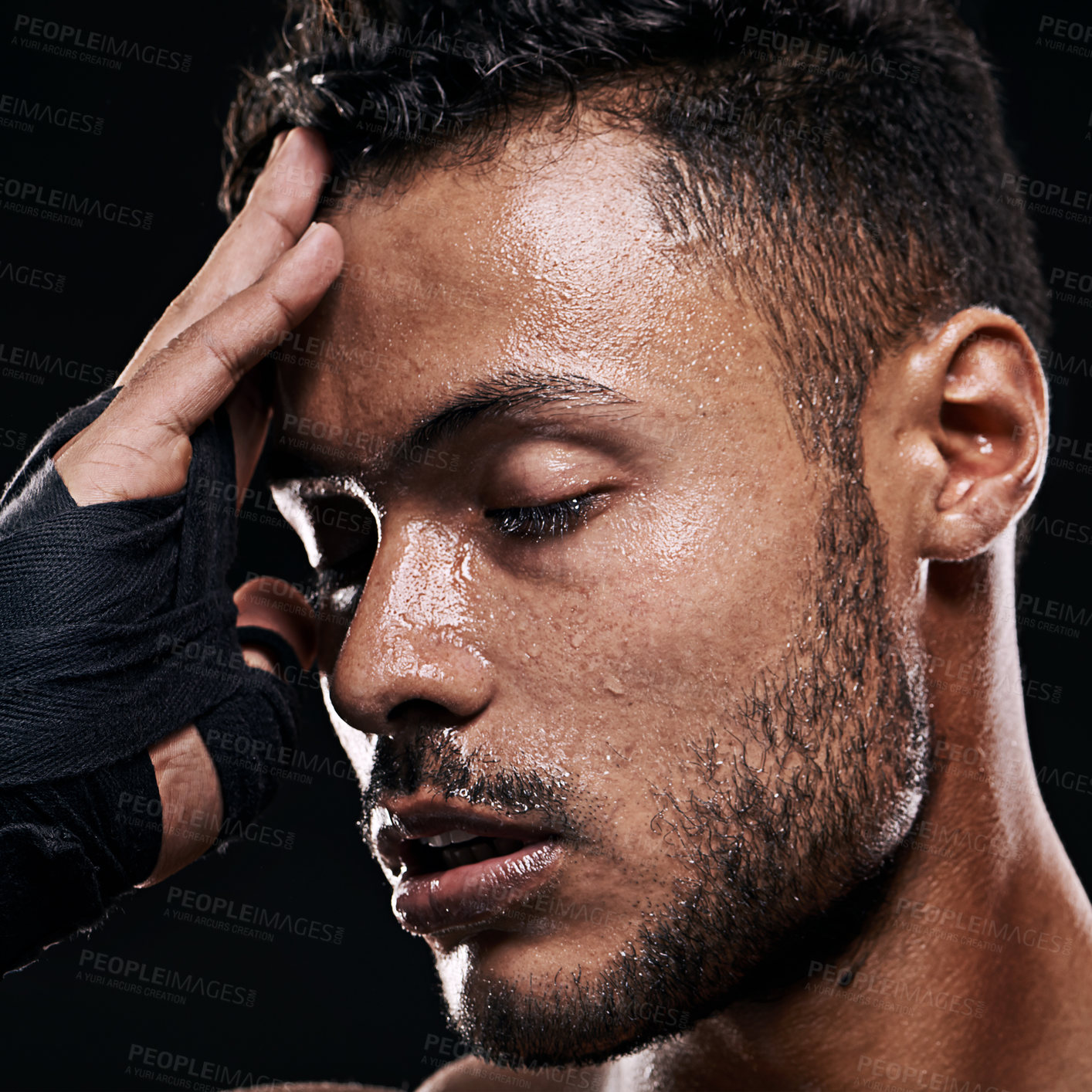 Buy stock photo Hands, gloves and tired man boxer in studio with headache, stress or intense exercise burnout on black background. Sweat, face and male athlete with sports, fatigue or pause for workout recovery