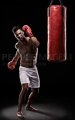 Buy stock photo Boxing, man and training in studio with punching bag for workout, exercise or competition fight with fitness. Athlete, boxer and confidence for martial arts with energy or topless on black background