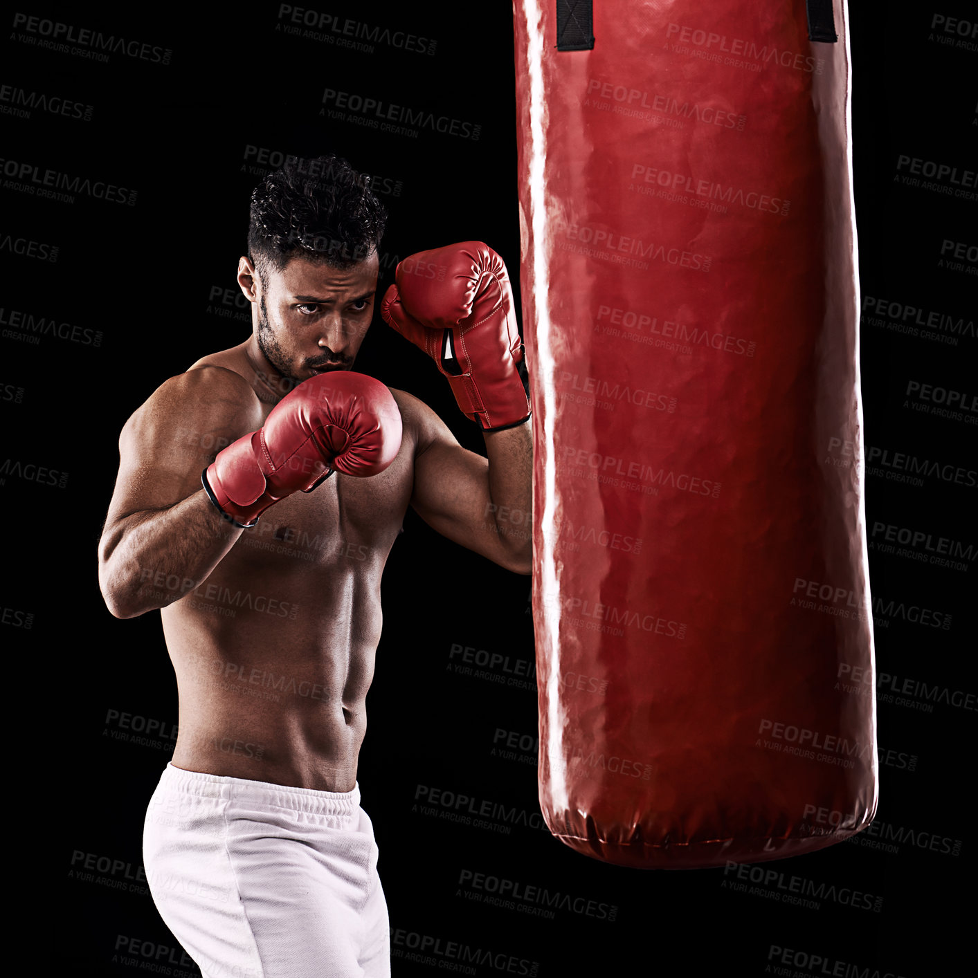 Buy stock photo Workout, boxer and man in studio with punching bag for training with strength and muscle. Adult, athlete and male person in dark background, healthy and power with body, fitness and sport for job