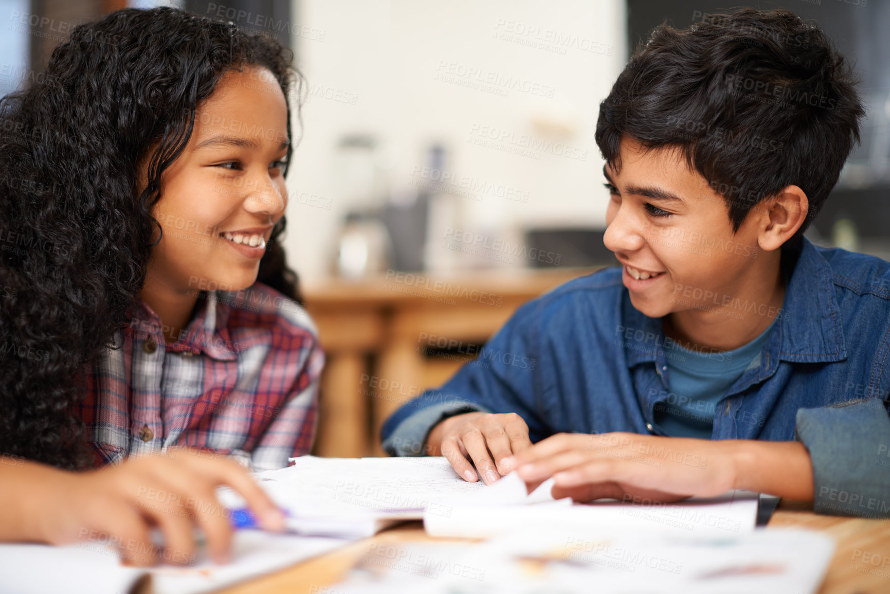 Buy stock photo Shot of two young students studying together in a classroom