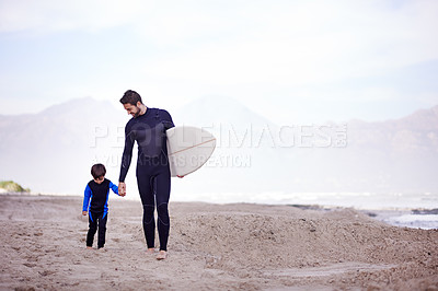 Buy stock photo Surfboard, man and child on beach, walking and holding hands on outdoor bonding adventure. Nature, father and son at ocean for surfing, teaching and learning together with support, trust and growth.
