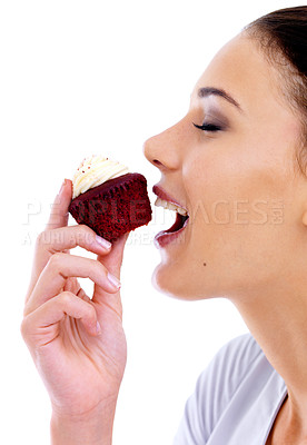 Buy stock photo Studio, woman and cupcake with happiness for nutrition, eating muffin and unhealthy diet. Female person, food and sweet dessert with cake, snack enjoyment and satisfaction on white background