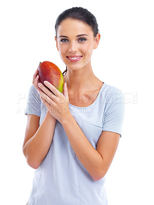 Buy stock photo Studio portrait of a beautiful young woman holding a mango isolated on white