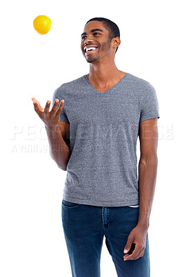 Buy stock photo Man, lemon and fruit for healthy and fresh for diet, immune system and vitamin. African person or dietician and smile with snack and throw in air for play, detox and citrus on white background 