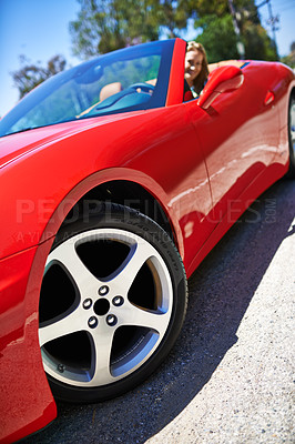 Buy stock photo Convertible, sports car and driving closeup with wheel in city, outdoor in summer and woman on road trip. Luxury, transport or driver to travel on highway with happiness in red vehicle on street