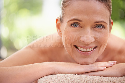 Buy stock photo Closeup, portrait or woman to relax, massage or spa as luxury, self care or wellness on zen table. Beauty, therapy or smile in mental health, detox or balance as skin, glow or bed on holistic retreat