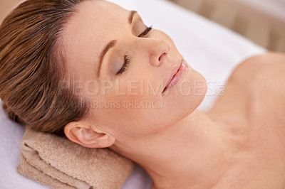 Buy stock photo Woman, face and spa with massage for wellness, eyes closed with calm for zen and self care. Cosmetics, beauty and facial, relax and peace at luxury resort with treatment for stress relief and healing