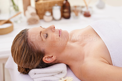 Buy stock photo Woman, face and top view with eyes closed at spa, massage and wellness with calm for zen and self care. Cosmetics, beauty and holistic healing, relax and peace at luxury resort with treatment