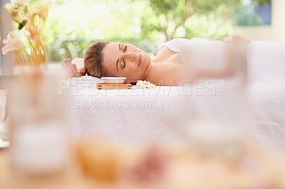 Buy stock photo Woman, relax and sleeping with towel at spa in stress relief, zen or health and wellness on massage table. Calm female person enjoying luxury skincare, body treatment or relaxation at peaceful resort