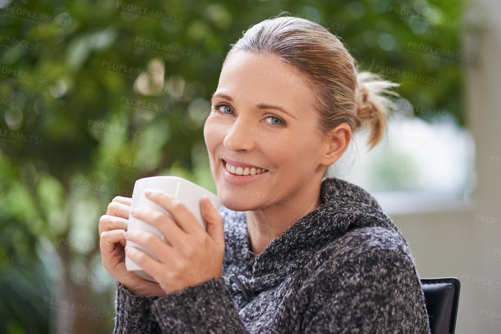 Buy stock photo Shot of an attractive mature woman enjoying a hot drink at a spa