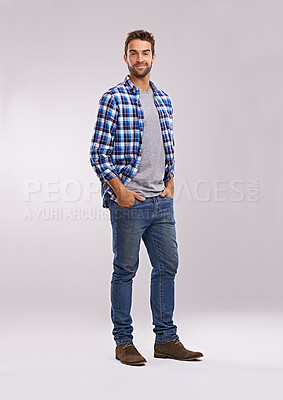 Buy stock photo Studio shot of a handsome man against a gray background