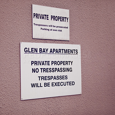 Buy stock photo Trespassing, warning and sign on apartment of property for caution, notification and information. Public signage, symbol and private building with board, poster and mistake for attention or safety