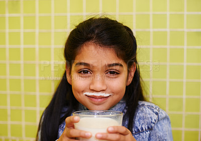 Buy stock photo Milk moustache, smile or girl portrait in house with healthy breakfast drink on yellow wall background. Protein, dairy and face of kid in india with milkshake for balance, energy or calcium nutrition