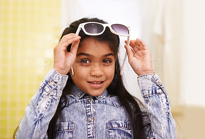 Buy stock photo Girl, portrait and sunglasses for home, holiday and vacation with fashion and cool style. Happy face of a young Mexican kid or child with smile, casual and trendy accessory or shades for fun indoors