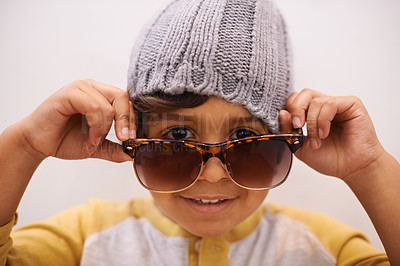 Buy stock photo Child, portrait and sunglasses with cool style and confidence with kid in a home. Happy, eyewear and youth fashion with an hipster boy with modern and casual accessory in a house with fun and frames