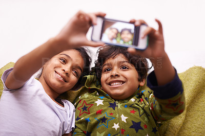 Buy stock photo Phone screen, selfie and kid siblings on a floor for fun, vacation or memory at home from above. Smartphone, photography and children in a living room smile for social media, blog or profile picture