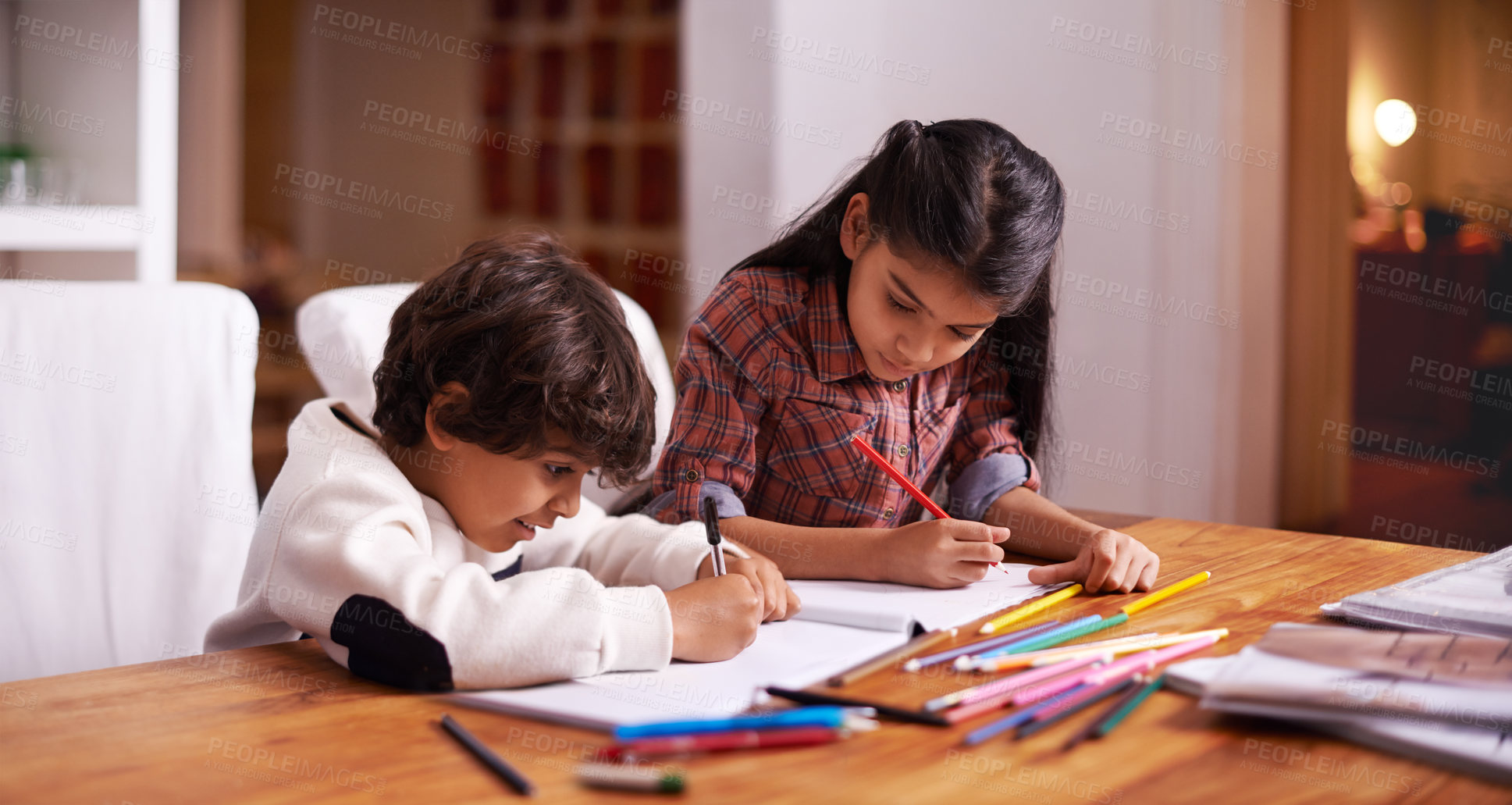 Buy stock photo Students, children and home for writing, learning and education in school books with color or drawing. Young sibling, girl and boy or kids with language development, homework and creativity at table