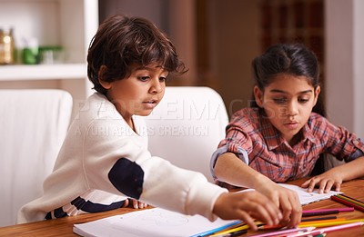 Buy stock photo Sibling, children and home for writing, learning and education with school books, color pencil and drawing. Students, girl and boy or kids with language development, homework and creativity at table