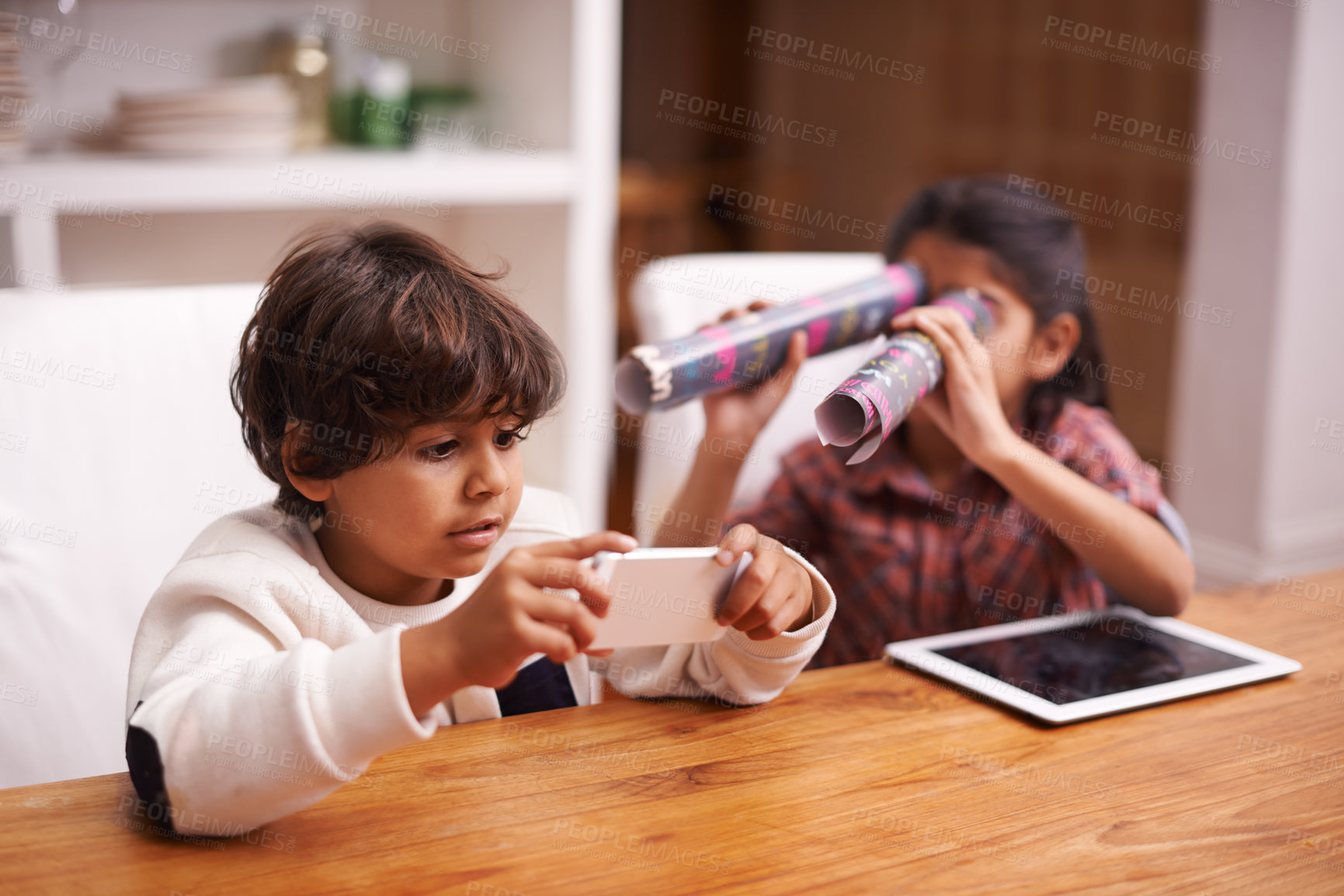 Buy stock photo Shot of two siblings having fun at home