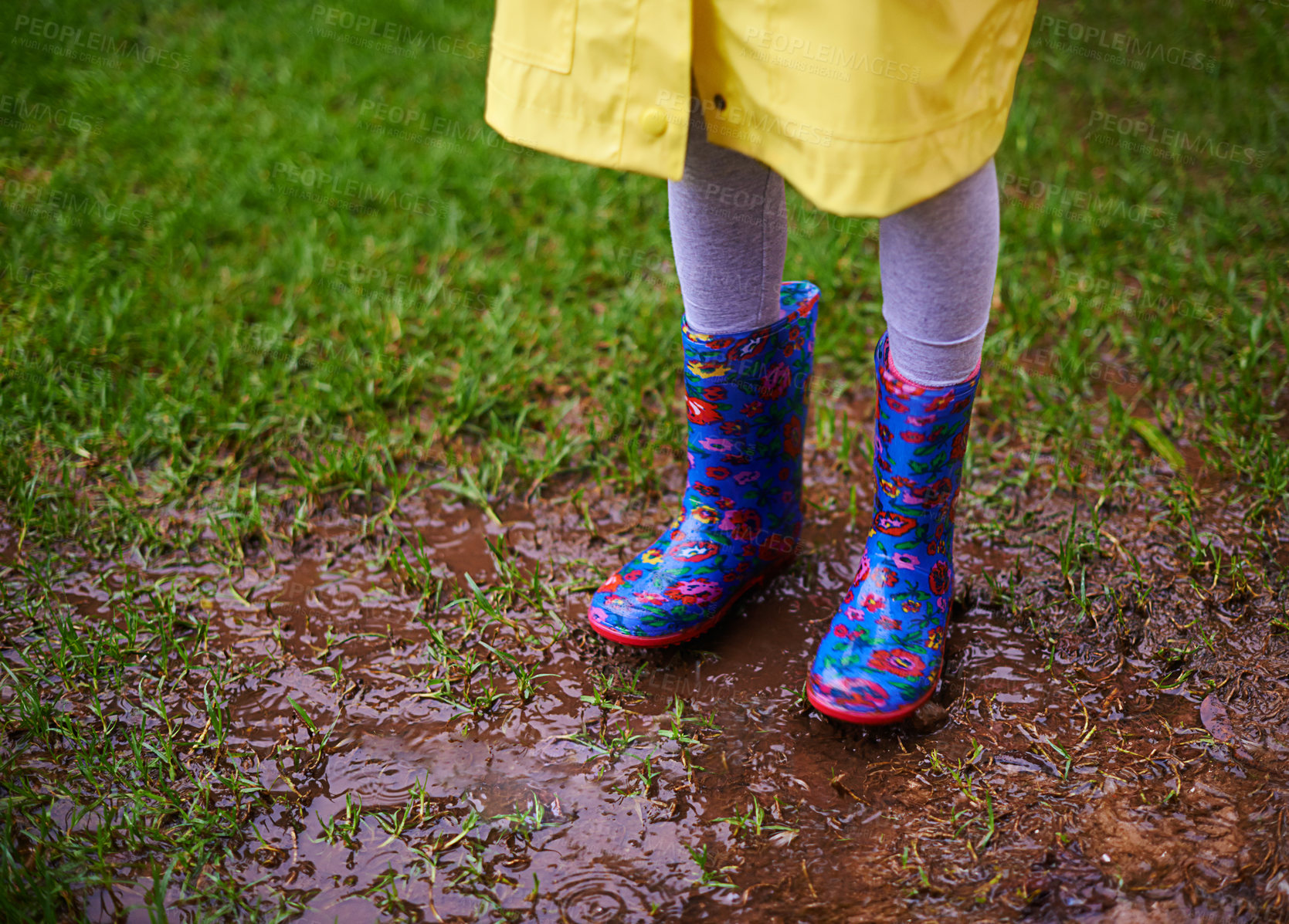 Buy stock photo Soil, feet and boots of kid playing in rain for forest, adventure or fun explore games in nature closeup. Earth, mud and shoes of child in woods for walking, camping or travel, holiday or vacation