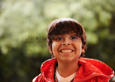Buy stock photo Rain, smile and portrait of boy in a forest for adventure, freedom or exploring games in nature. Winter, travel and face of excited kid in India outdoor for learning, journey or freedom in a storm