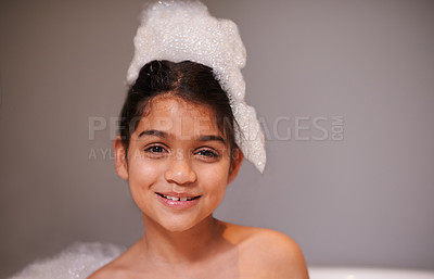 Buy stock photo Bubble bath, portrait or happy girl with soap in house for body care, washing or cleaning. Bathtub, face and playful kid in bathroom with wellness skincare cosmetics, hygiene or fun with water splash