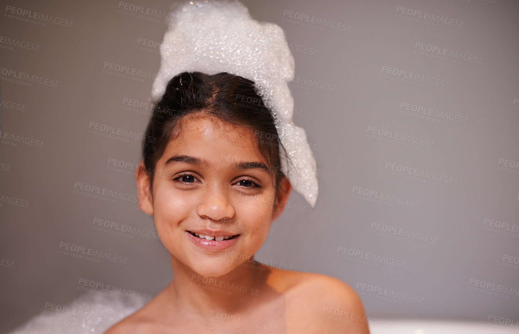 Buy stock photo Bubble bath, portrait or happy girl with soap in house for body care, washing or cleaning. Bathtub, face and playful kid in bathroom with wellness skincare cosmetics, hygiene or fun with water splash