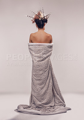 Buy stock photo Person, studio and fashion in culture headdress with feathers in hair, back and designer in trendy cloth. Model, boho hairstyle and indigenous couture in gown, modern and elegant on grey background