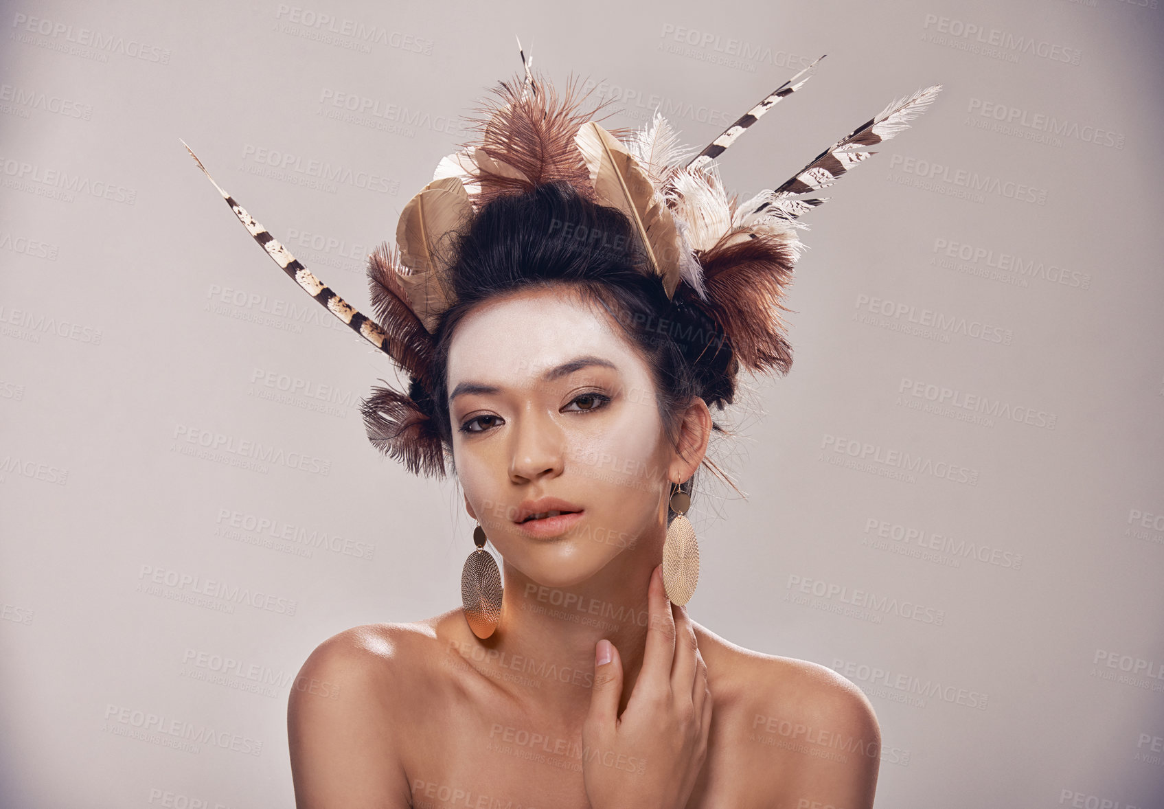 Buy stock photo A portrait of a young woman in a native american-inspired headdress