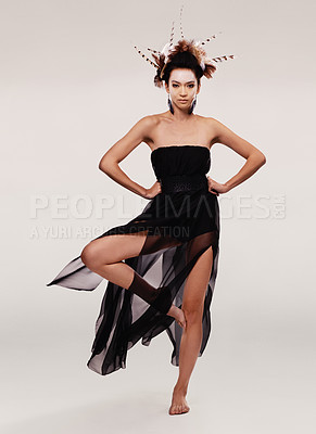 Buy stock photo Woman, dress and portrait in studio for fashion, trendy clothes and art deco for style and beauty. Model or young person with chiffon gown, designer outfit and feathers for elegant and creative