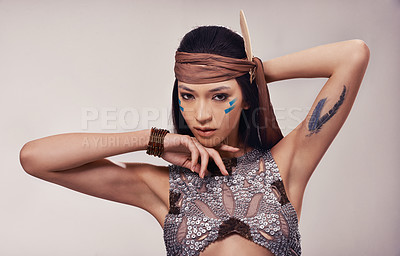 Buy stock photo Portrait, beauty and Native American woman in studio with warrior makeup, confidence and tribe style. Indigenous fashion, face paint or girl in First Nations clothes on white background with culture