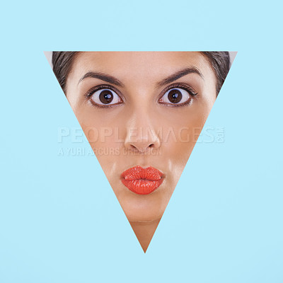 Buy stock photo Face, woman and makeup or beauty in cutout and studio for cosmetics, skincare and dermatology with pout or surprise. Face of model or young person in foundation and triangle shape on blue background