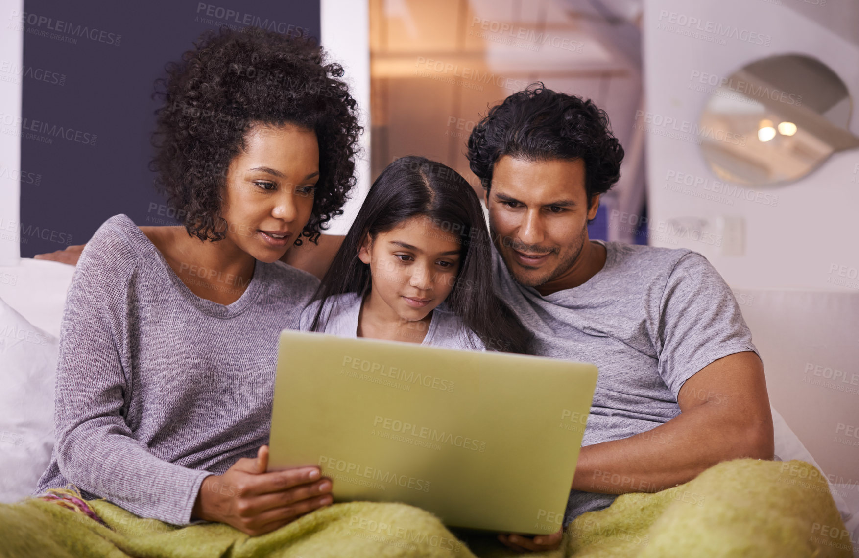 Buy stock photo Family, girl and sofa with laptop to watch movie on online website for educational programs or child development. Parents, home and bonding with streaming cartoon in living room, learning and support