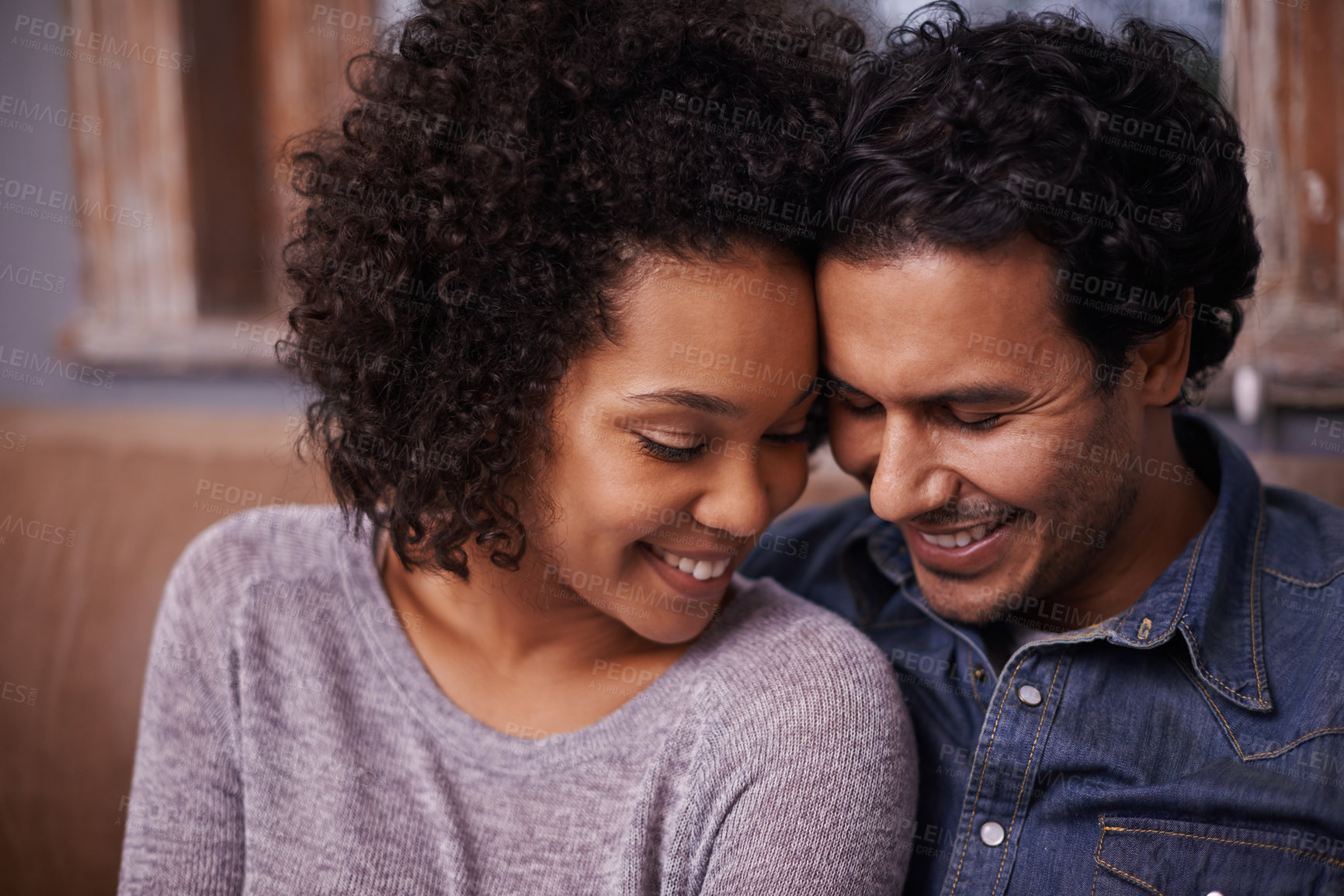 Buy stock photo Love, face and happy couple hug and relax in a living room, smile and enjoying intimate marriage in their home together. Romance, soulmate and woman with man in a lounge for romantic bonding indoors