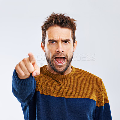 Buy stock photo Angry man, portrait and pointing to you with scream for choice, pick or frustration on a white studio background. Frustrated male person or model yelling or shouting with mood or attitude on mockup